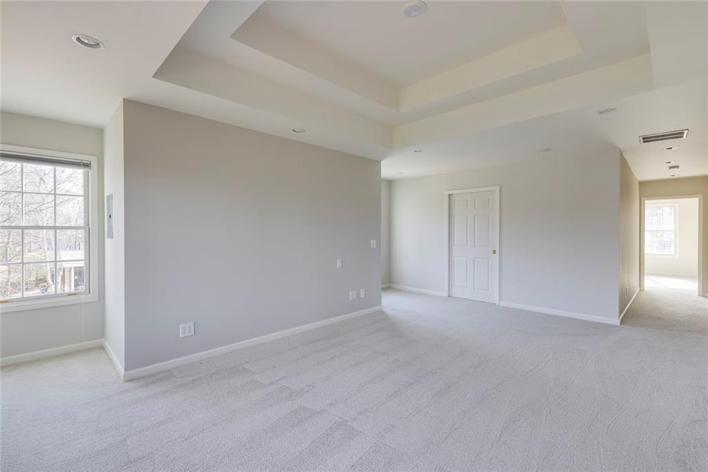 1416 Vernon Ridge Close Atlanta, GA 30338 - Photo 29 of 59 an empty room with windows and closet