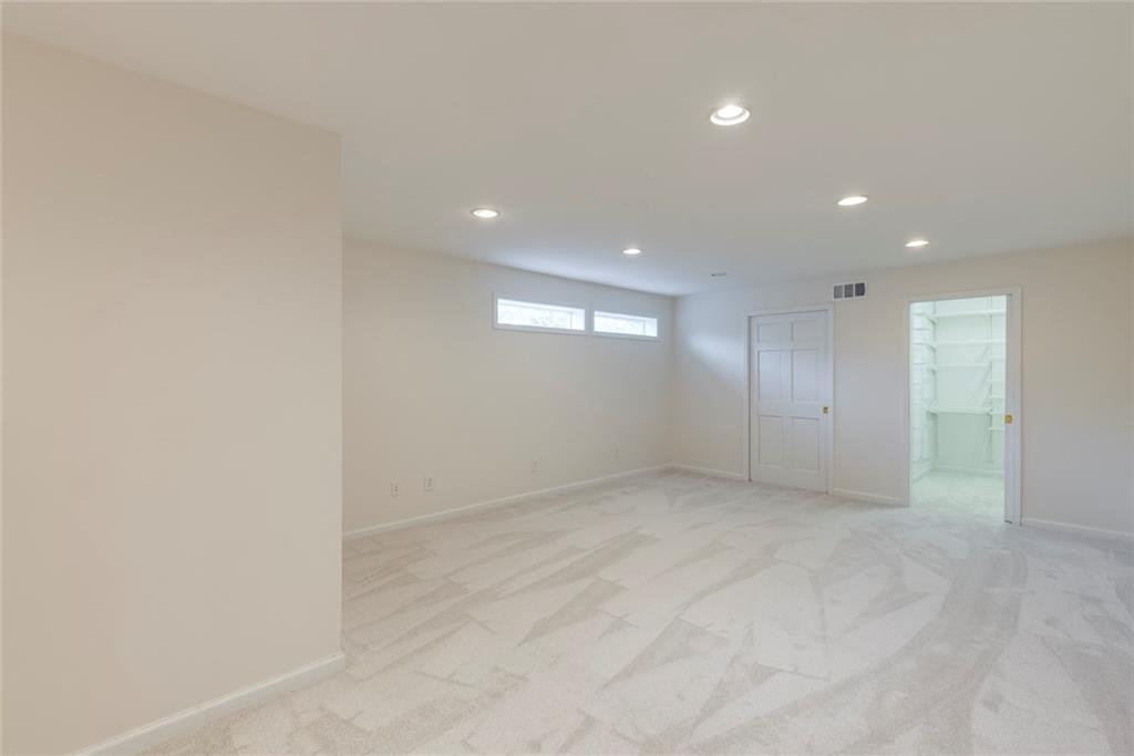 1416 Vernon Ridge Close Atlanta, GA 30338 - Photo 44 of 59 an empty room with window and pillar in it