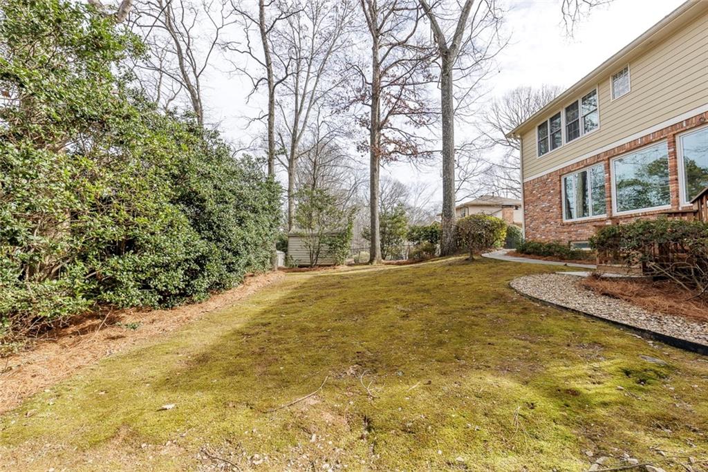 1416 Vernon Ridge Close Atlanta, GA 30338 - Photo 55 of 59 a view of swimming pool with large trees and plants