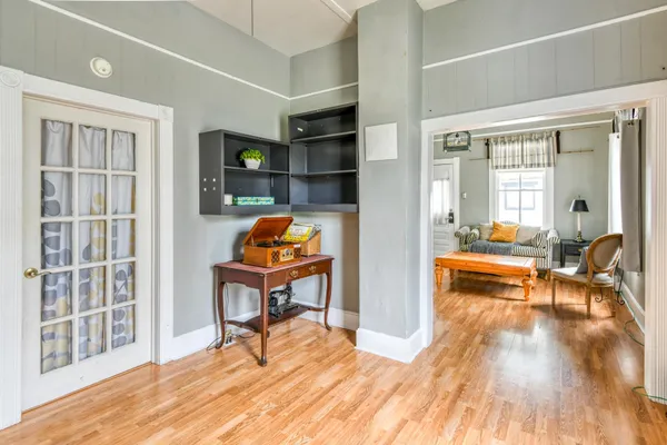 a bedroom with a large bed and a window