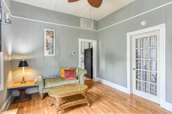 a spacious bedroom with a bed and a window