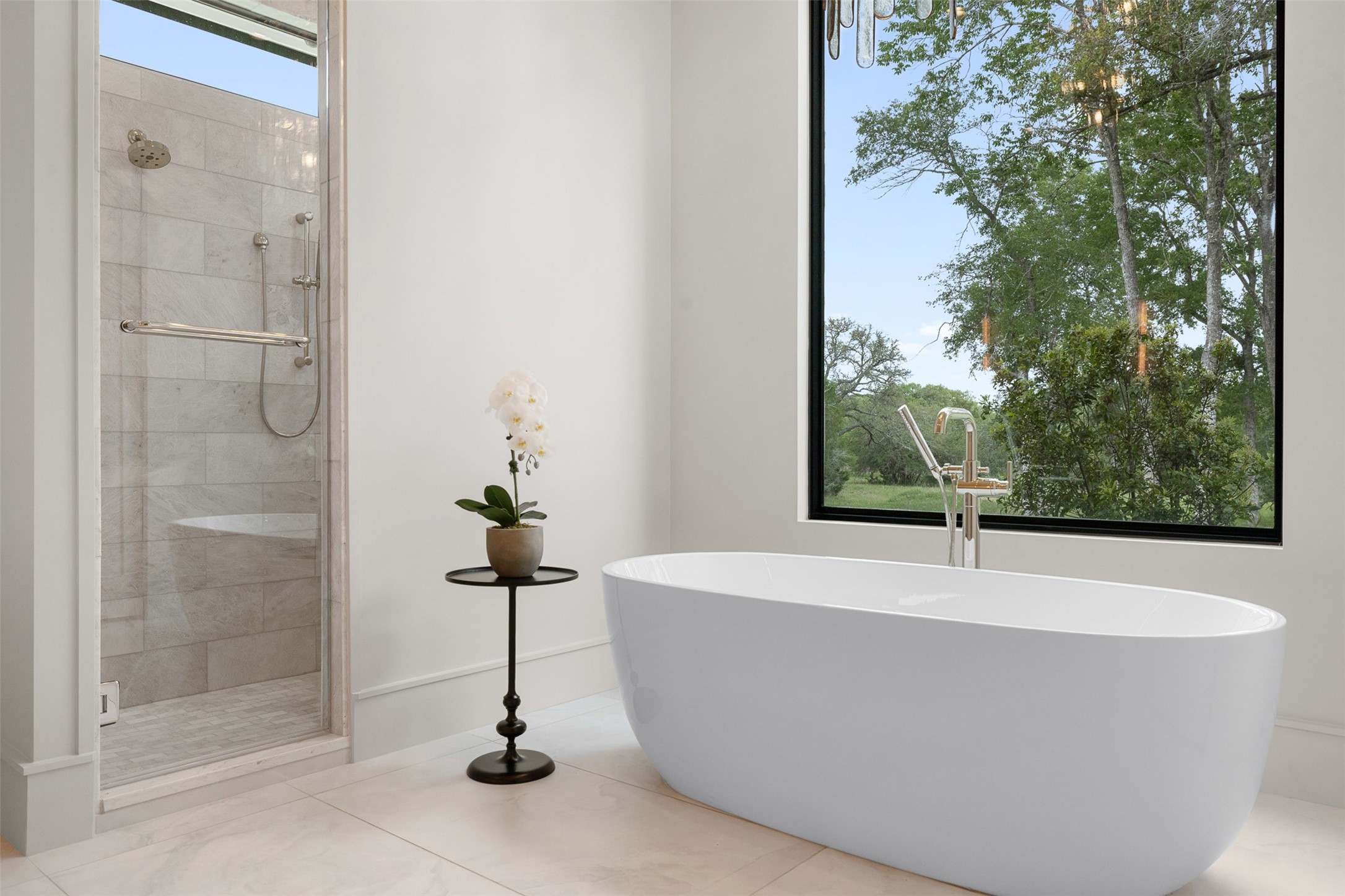 770 South Weyand Road Round Top, TX 78954 - Photo 27 of 50 a white bath tub sitting next to a shower