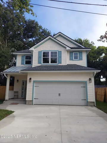 a front view of a house with a garage