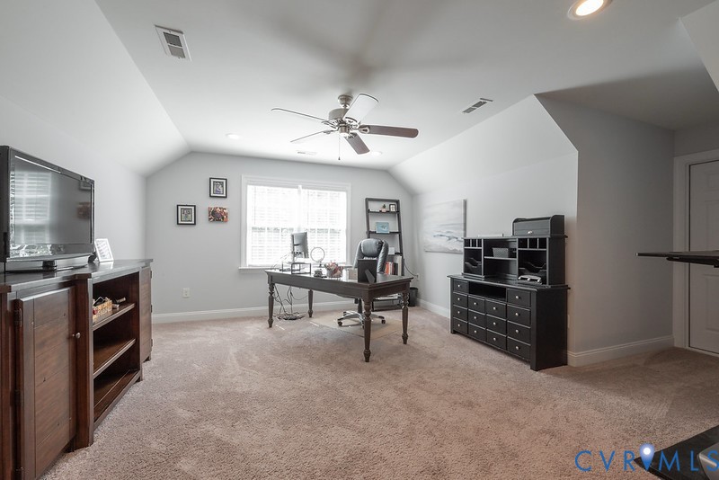 9425 Marie Road New Kent, VA 23124 - Photo 8 of 55 a living room with furniture and a flat screen tv