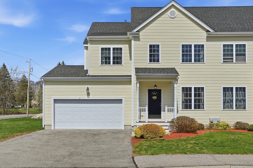 2 Dino Way, Unit 52 Milford, MA 01757 - Photo 1 of 41 a front view of a house with garden