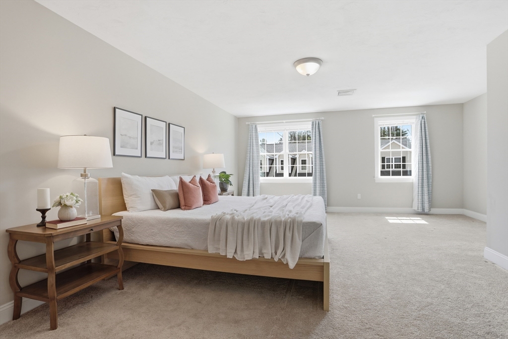 2 Dino Way, Unit 52 Milford, MA 01757 - Photo 19 of 41 a bedroom with a bed and a window
