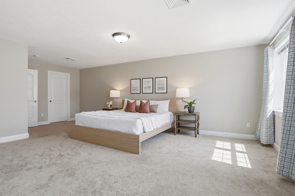 2 Dino Way, Unit 52 Milford, MA 01757 - Photo 20 of 41 a bedroom with a bed and a window