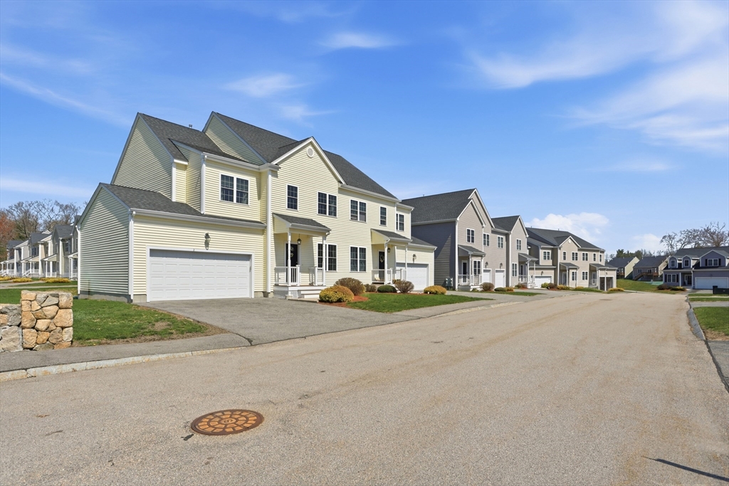 2 Dino Way, Unit 52 Milford, MA 01757 - Photo 2 of 41 a view of multiple houses with a street