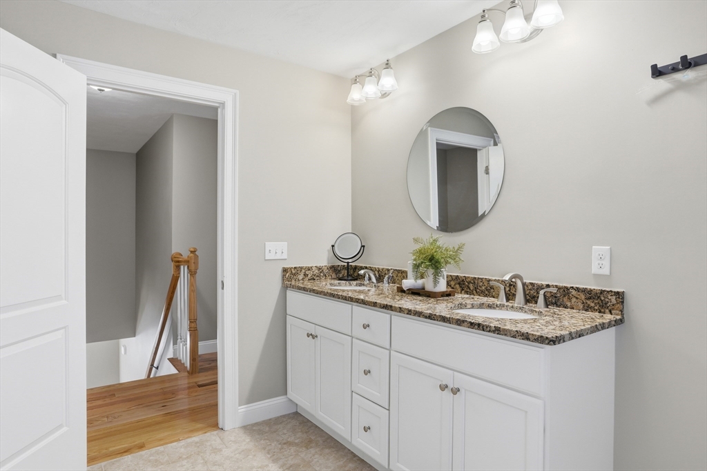 2 Dino Way, Unit 52 Milford, MA 01757 - Photo 27 of 41 a bathroom with a double vanity sink and a mirror