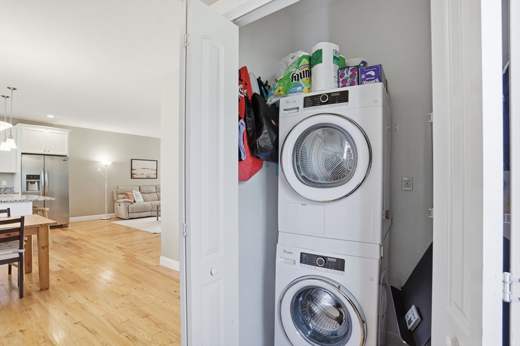 2 Dino Way, Unit 52 Milford, MA 01757 - Photo 32 of 41 a view of a hallway with washer and dryer