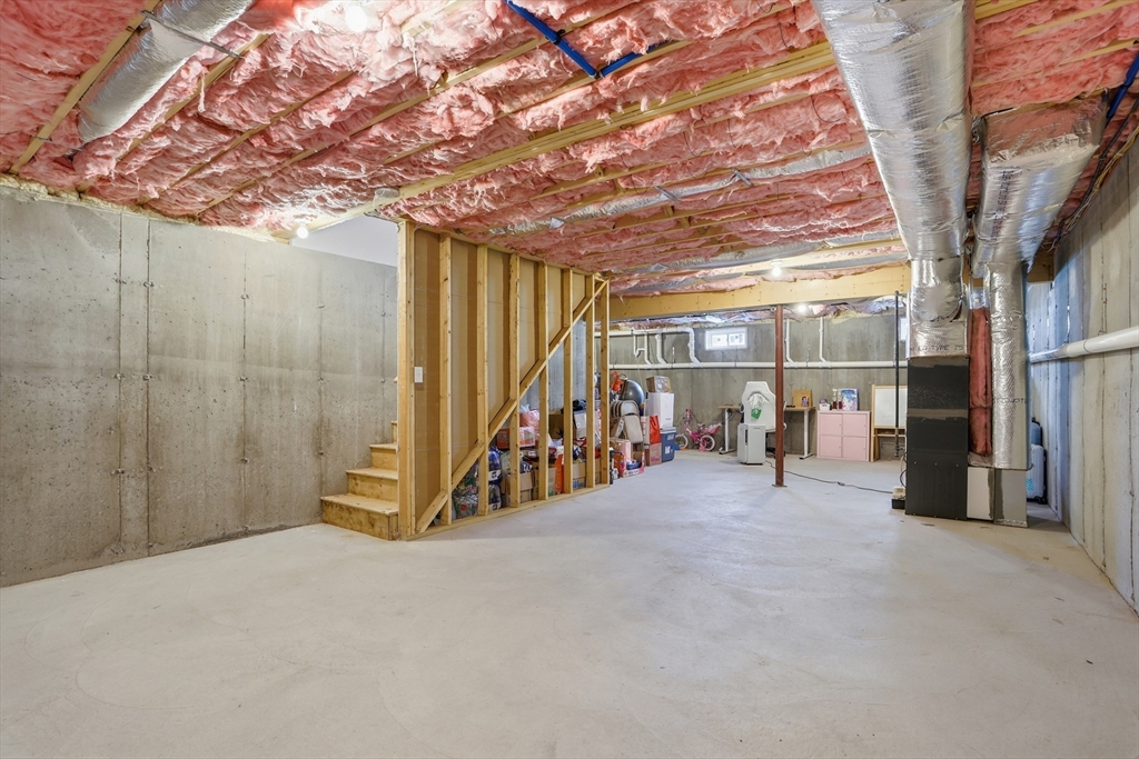 2 Dino Way, Unit 52 Milford, MA 01757 - Photo 34 of 41 a view of a room with wooden walls and stairs