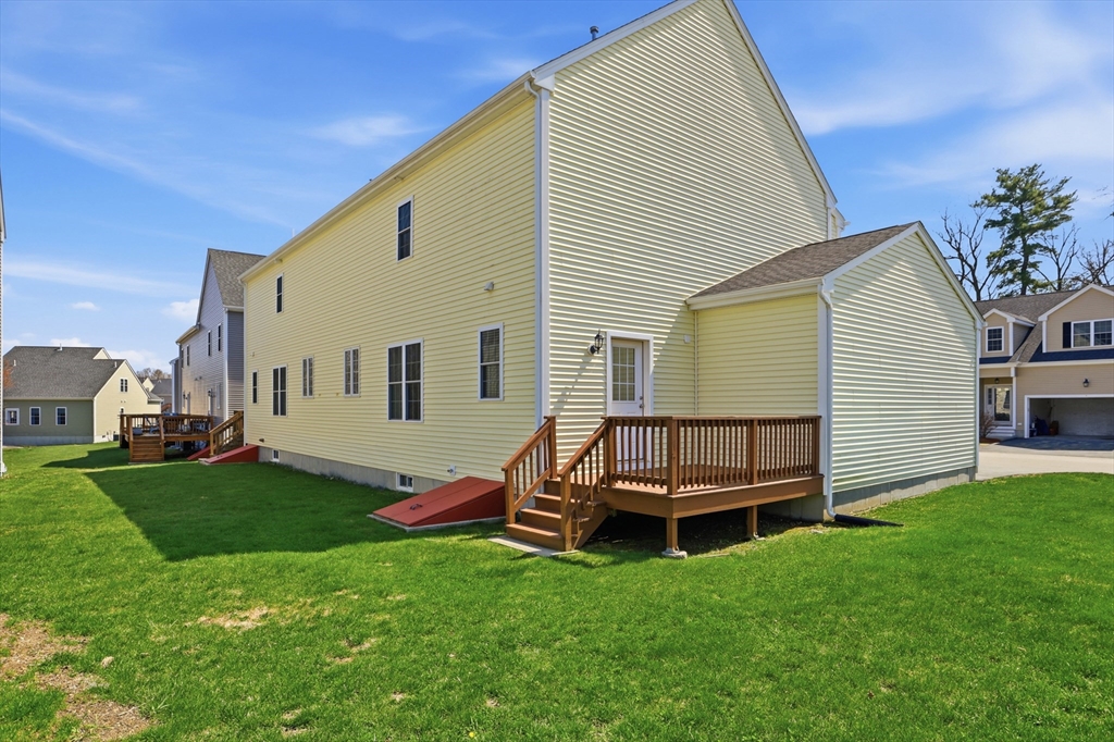 2 Dino Way, Unit 52 Milford, MA 01757 - Photo 37 of 41 a view of a house with backyard