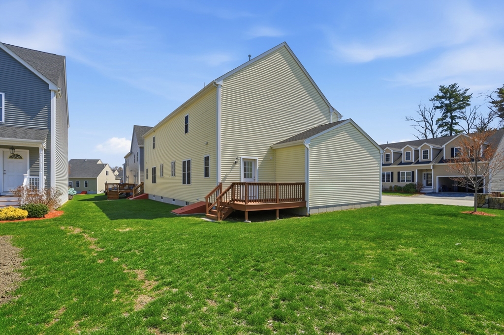 2 Dino Way, Unit 52 Milford, MA 01757 - Photo 38 of 41 a view of a house with a yard and sitting area