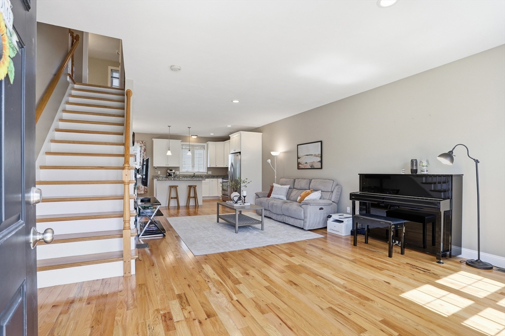 2 Dino Way, Unit 52 Milford, MA 01757 - Photo 4 of 41 a living room with furniture and a piano