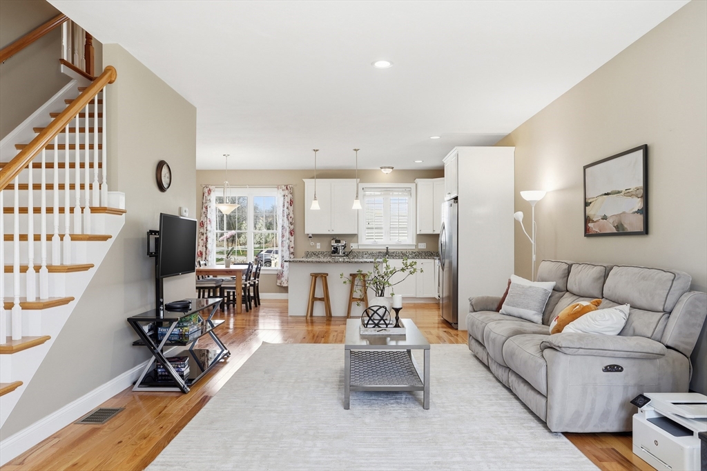 2 Dino Way, Unit 52 Milford, MA 01757 - Photo 6 of 41 a living room with furniture and wooden floor