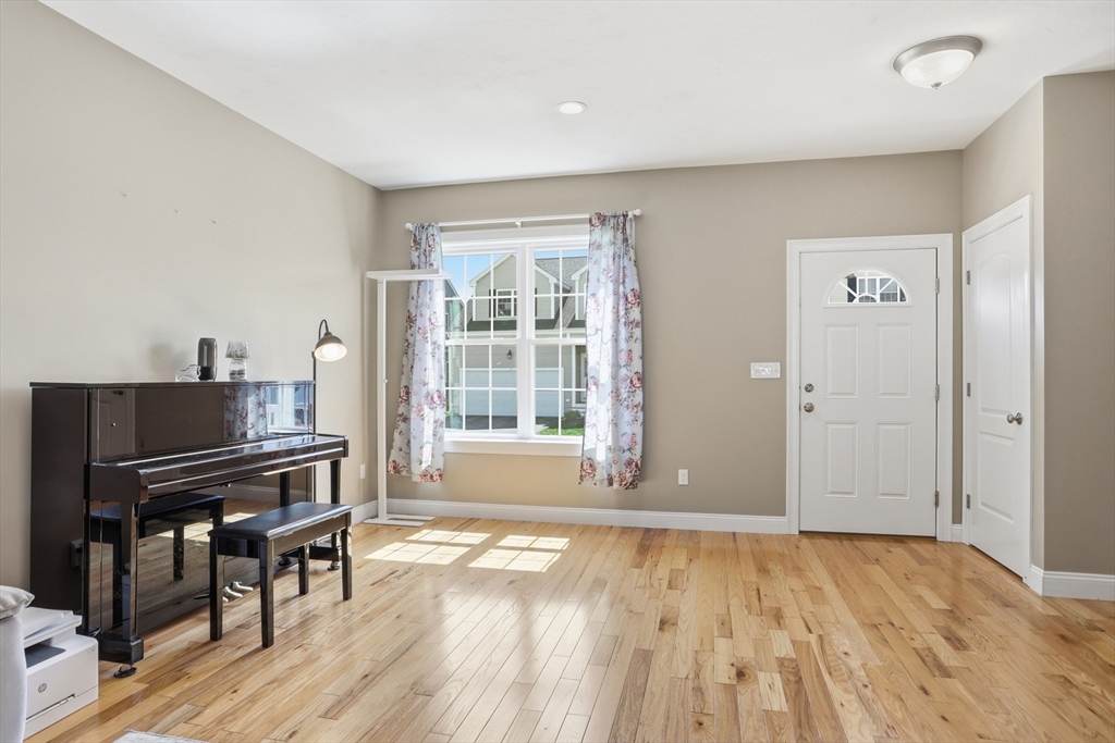 2 Dino Way, Unit 52 Milford, MA 01757 - Photo 9 of 41 wooden floor and windows in a room
