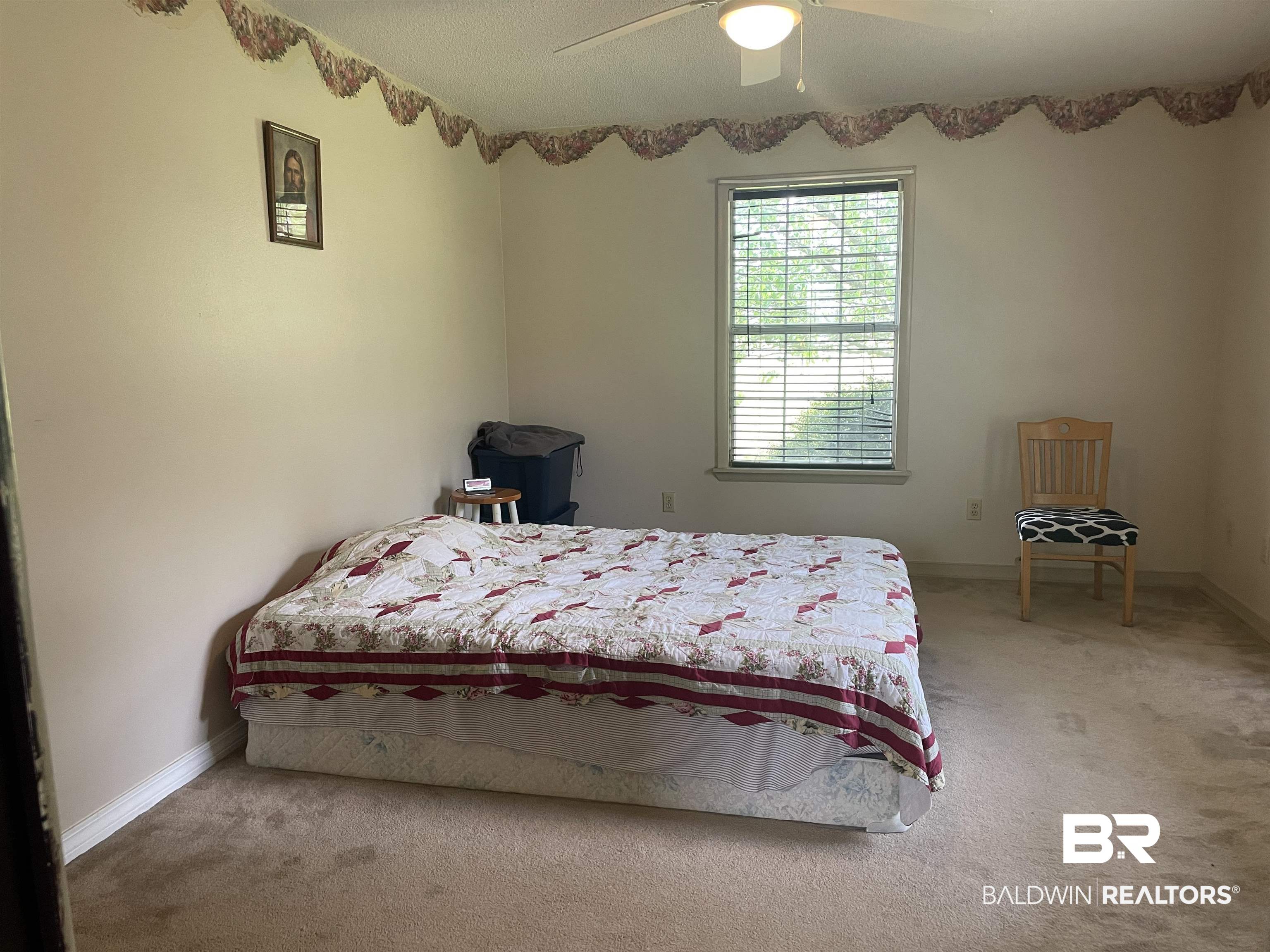 739 Smithfield Road Atmore, AL 36502 - Photo 6 of 18 Unfurnished bedroom with carpet flooring, baseboards, and ceiling fan