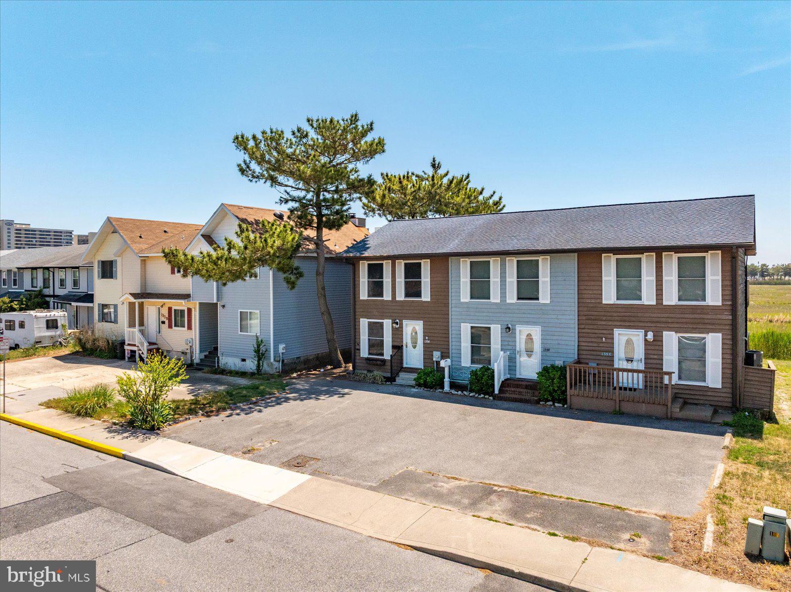 135 Jamestown Road, Unit 18A Ocean City, MD 21842 - Photo 2 of 63 a front view of a residential apartment building with a yard