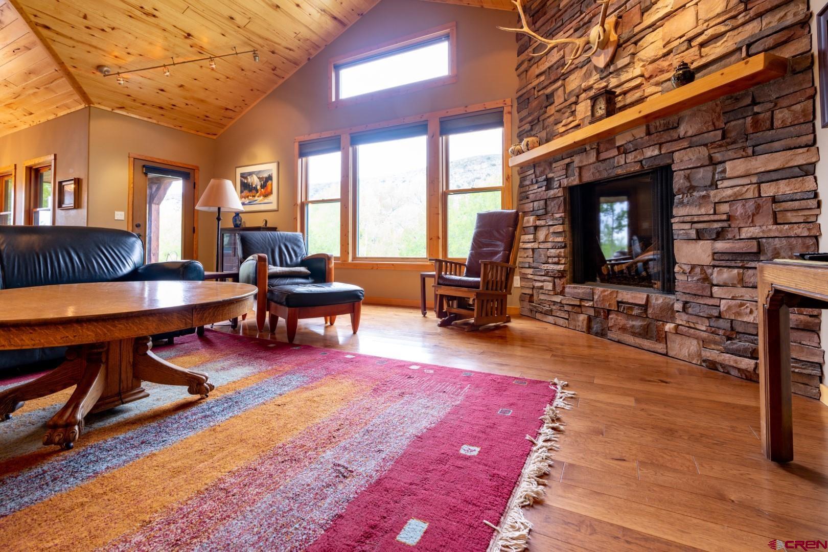 305 Roper Lane Almont, CO 81210 - Photo 15 of 35 a living room with furniture and a flat screen tv