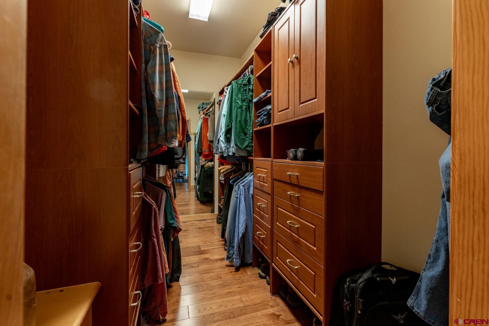 305 Roper Lane Almont, CO 81210 - Photo 32 of 35 a view of walk in closet with clothes and shoes