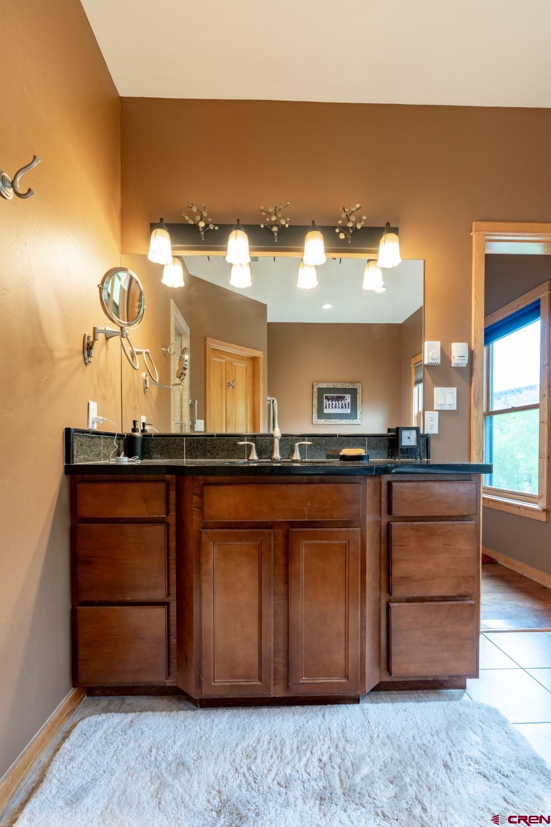 305 Roper Lane Almont, CO 81210 - Photo 35 of 35 a bathroom with a sink and a mirror