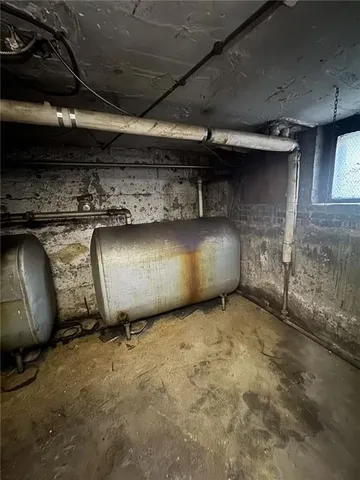 an empty room with a fireplace