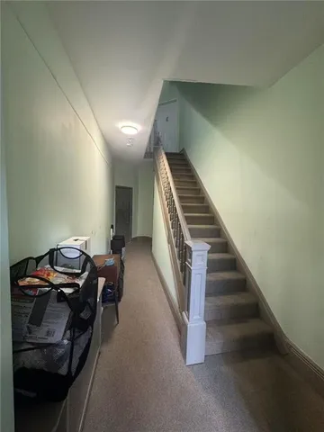 a view of a hallway with staircase