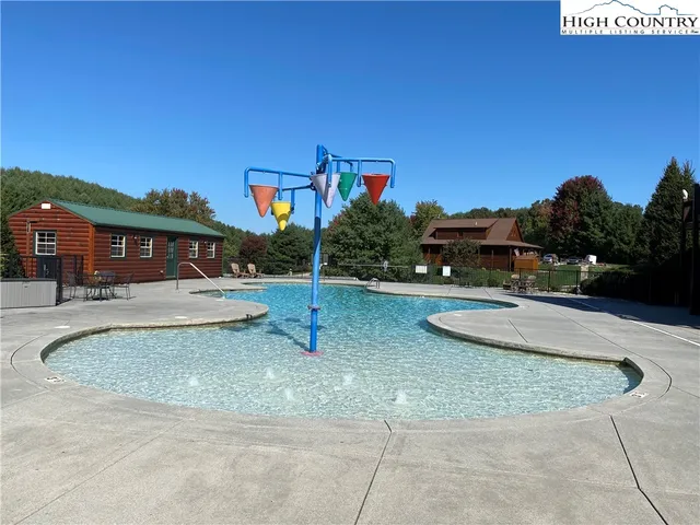a view of a house with swimming pool