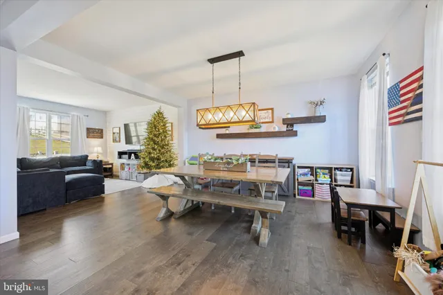 a living room with furniture and a dining area