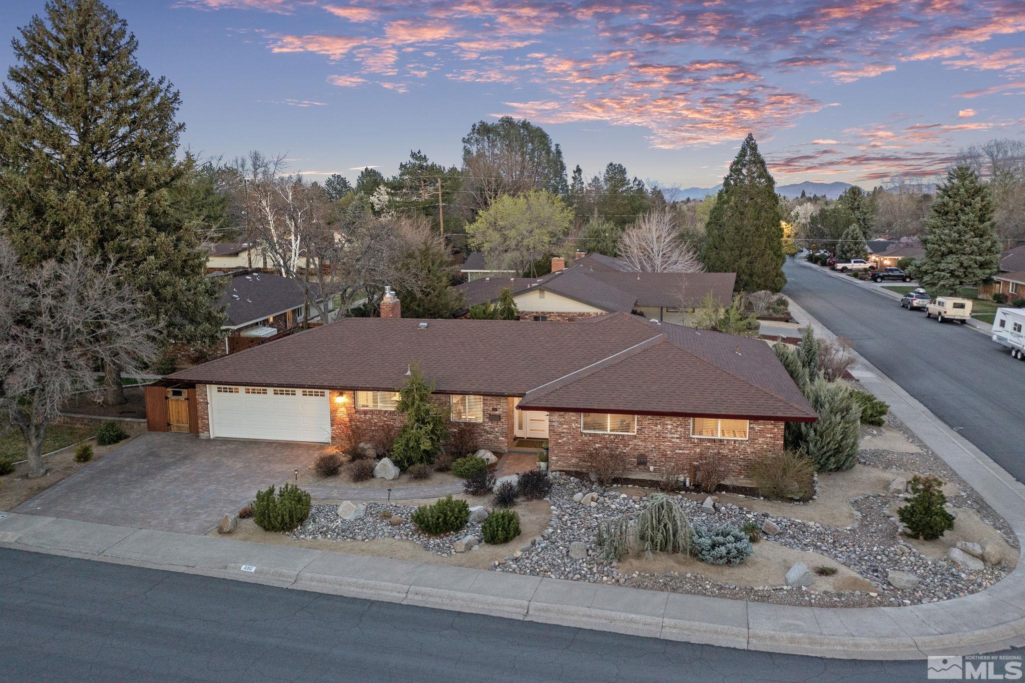 690 Shamrock Lane Reno, NV 89509 - Photo 2 of 30 a view of a house with a yard plants and large tree