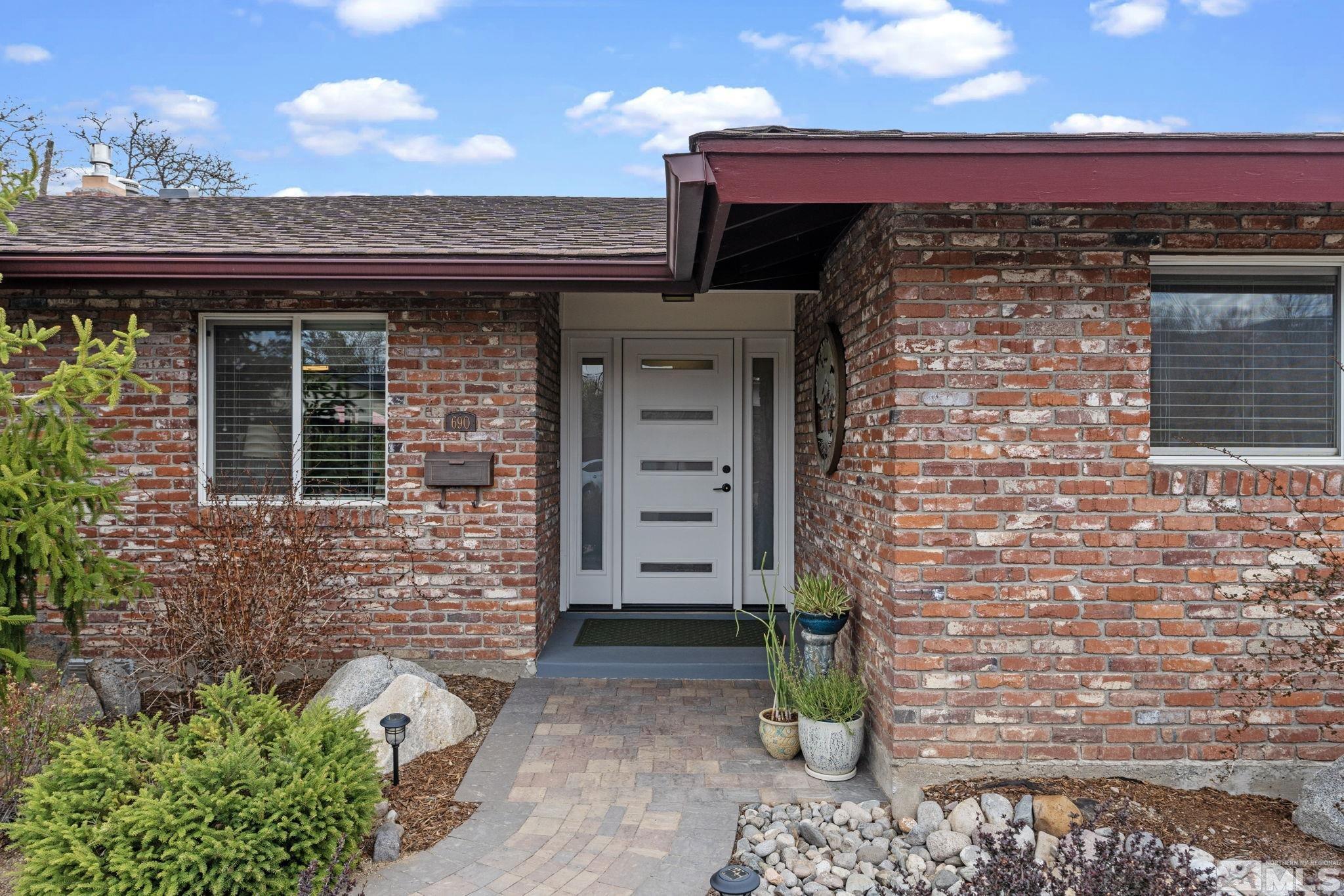 690 Shamrock Lane Reno, NV 89509 - Photo 4 of 30 a front view of a house with a garden
