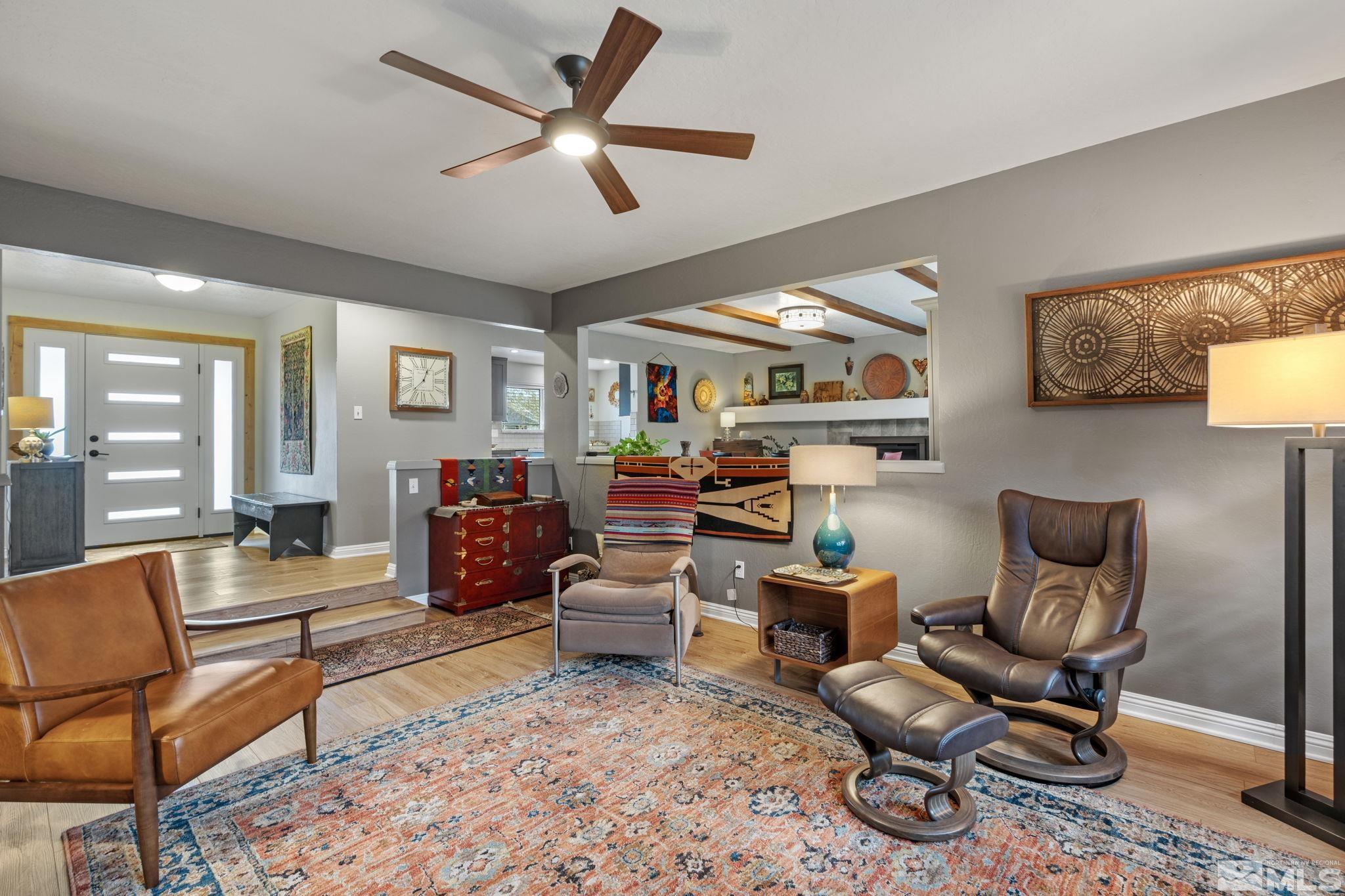 690 Shamrock Lane Reno, NV 89509 - Photo 7 of 30 a living room with furniture a rug and a chandelier