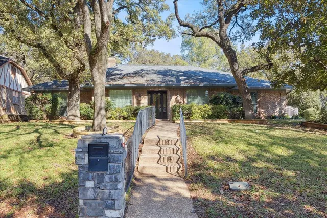 a view of a chairs and table in the patio
