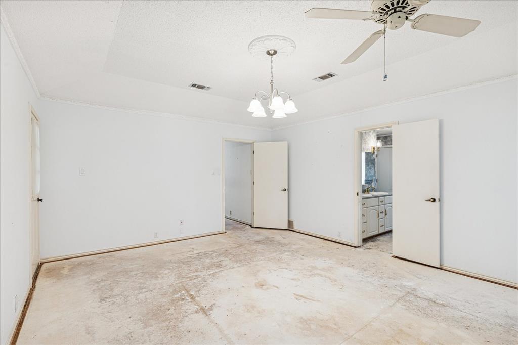 805 Newport Road Fort Worth, TX 76120 - Photo 21 of 27 a view of an empty room with a ceiling fan