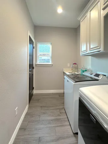 a utility room with washer and dryer
