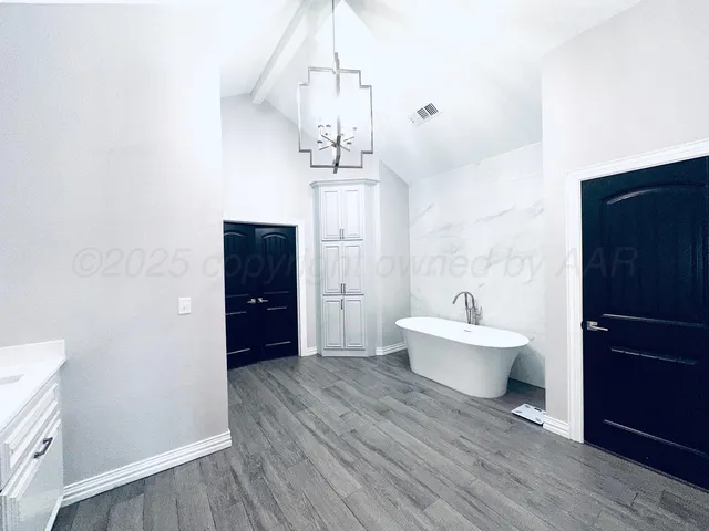 a bathroom with a bathtub shower sink and toilet