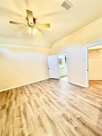 a view of a room with wooden floor