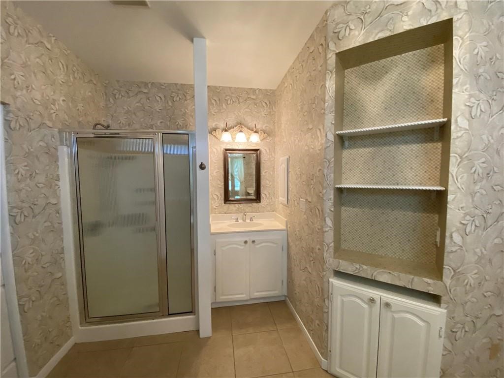 7814 Regal Street Corpus Christi, TX 78413 - Photo 20 of 35 a bathroom with a bathtub and a shower