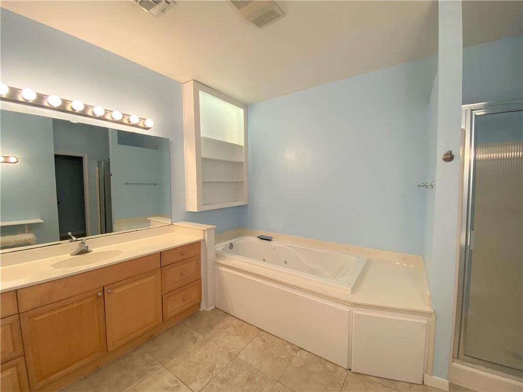 7814 Regal Street Corpus Christi, TX 78413 - Photo 23 of 35 a bathroom with a tub sink and mirror