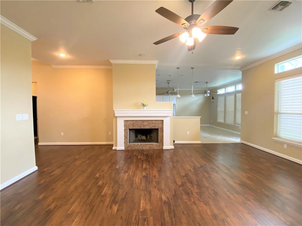 7814 Regal Street Corpus Christi, TX 78413 - Photo 3 of 35 a view of an empty room with a fireplace and a window