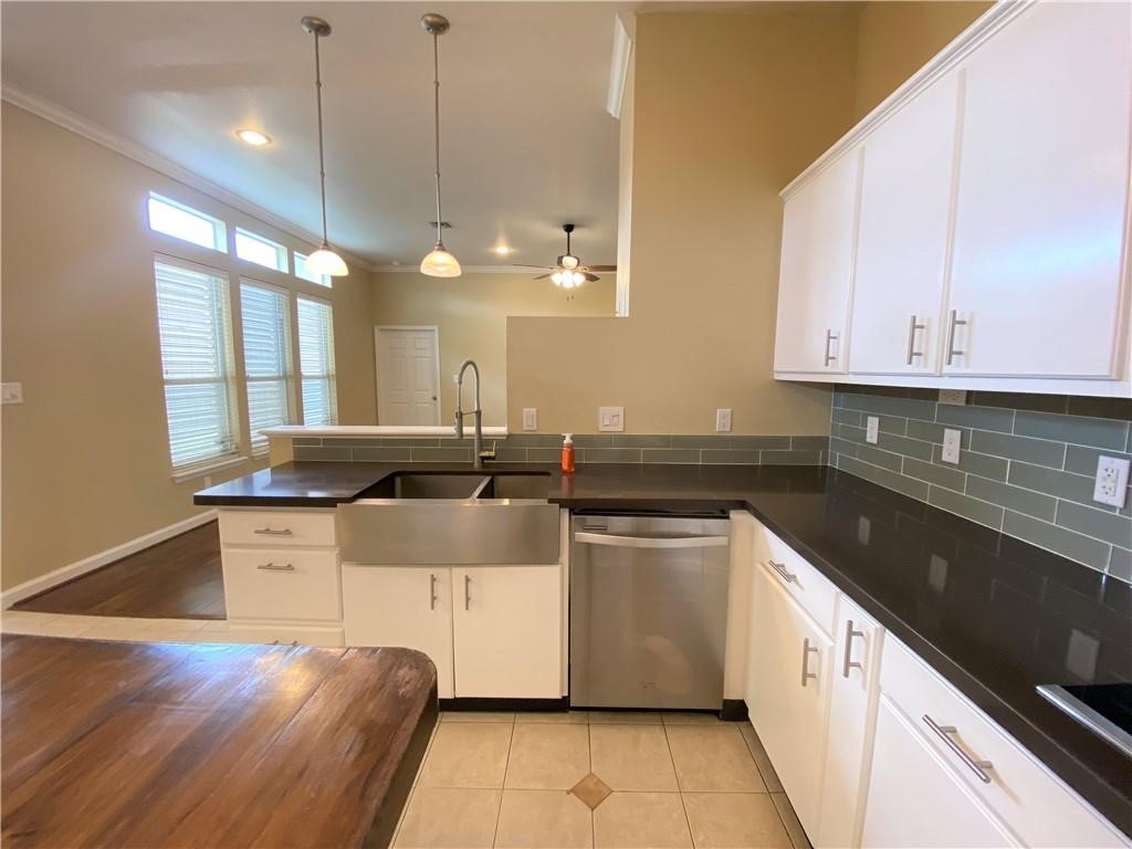 7814 Regal Street Corpus Christi, TX 78413 - Photo 6 of 35 a kitchen with stainless steel appliances granite countertop a sink a stove and a wooden floors
