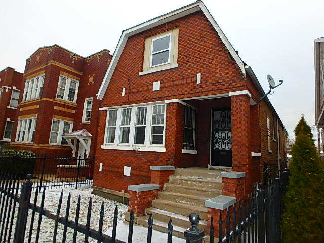 6325 South Talman Avenue Chicago, IL 60629 - Photo 1 of 1 a front view of a house with a porch