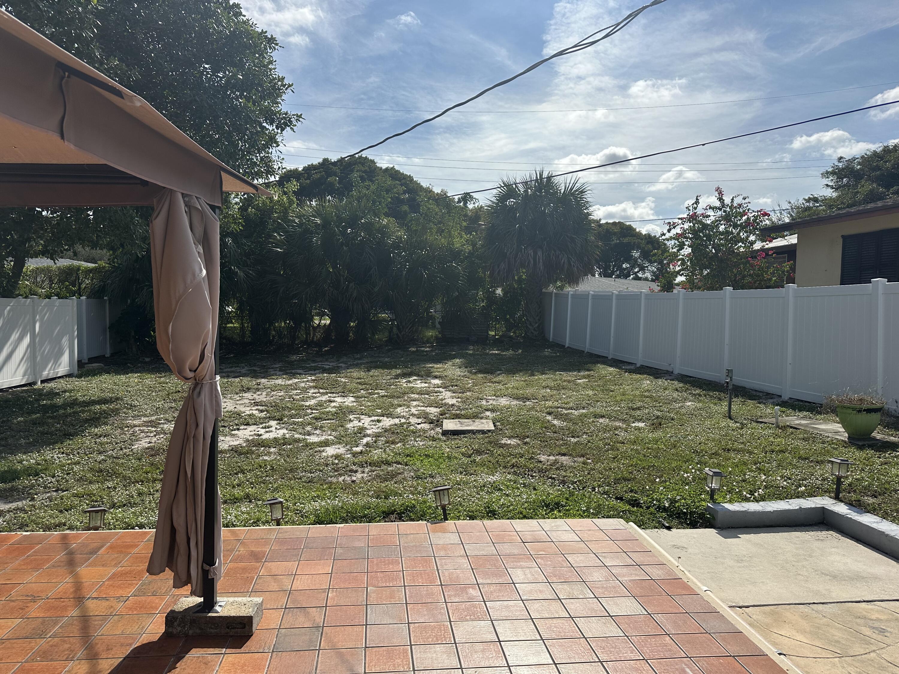 1092 Florence Road Lantana, FL 33462 - Photo 12 of 15 a view of a back yard