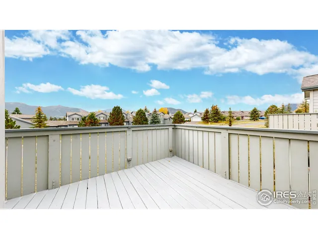 a bathroom with a sink a toilet a mirror and shower