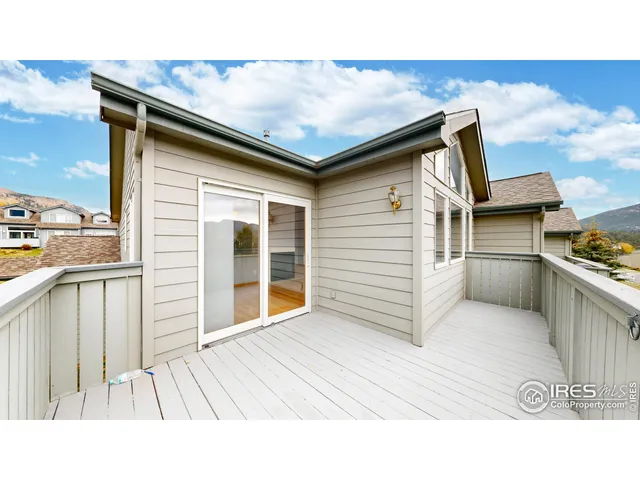 a balcony with view of living room