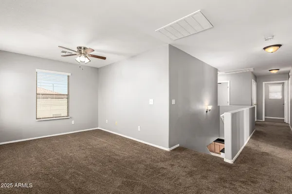 a view of an empty room with a window