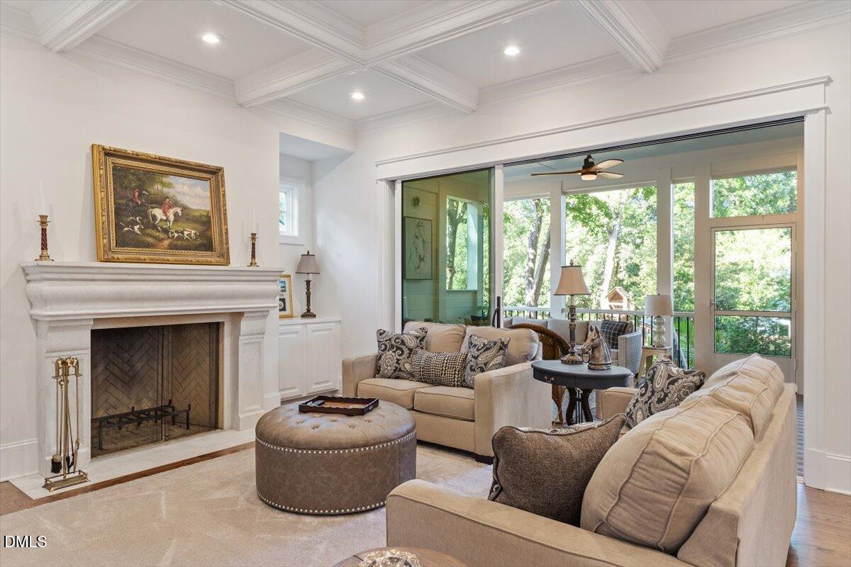 1713 Oberlin Road Raleigh, NC 27608 - Photo 12 of 53 a living room with furniture and a fireplace