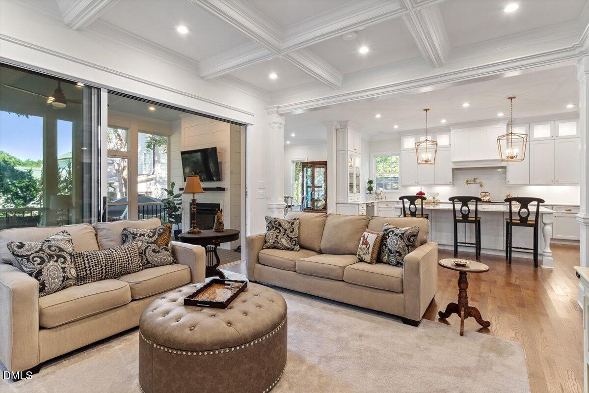 1713 Oberlin Road Raleigh, NC 27608 - Photo 14 of 53 a living room with furniture and a wooden floor