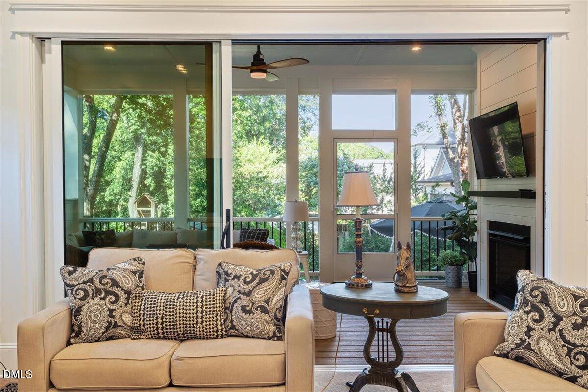 1713 Oberlin Road Raleigh, NC 27608 - Photo 15 of 53 a living room with furniture and a fireplace