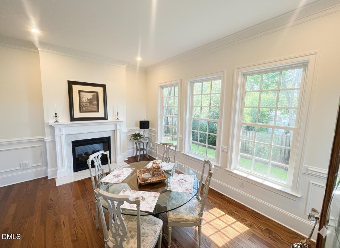 1713 Oberlin Road Raleigh, NC 27608 - Photo 21 of 53 a living room with furniture and a fireplace